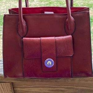 Wilsons leather”purse. The purple cast on the silver button is my clothes.